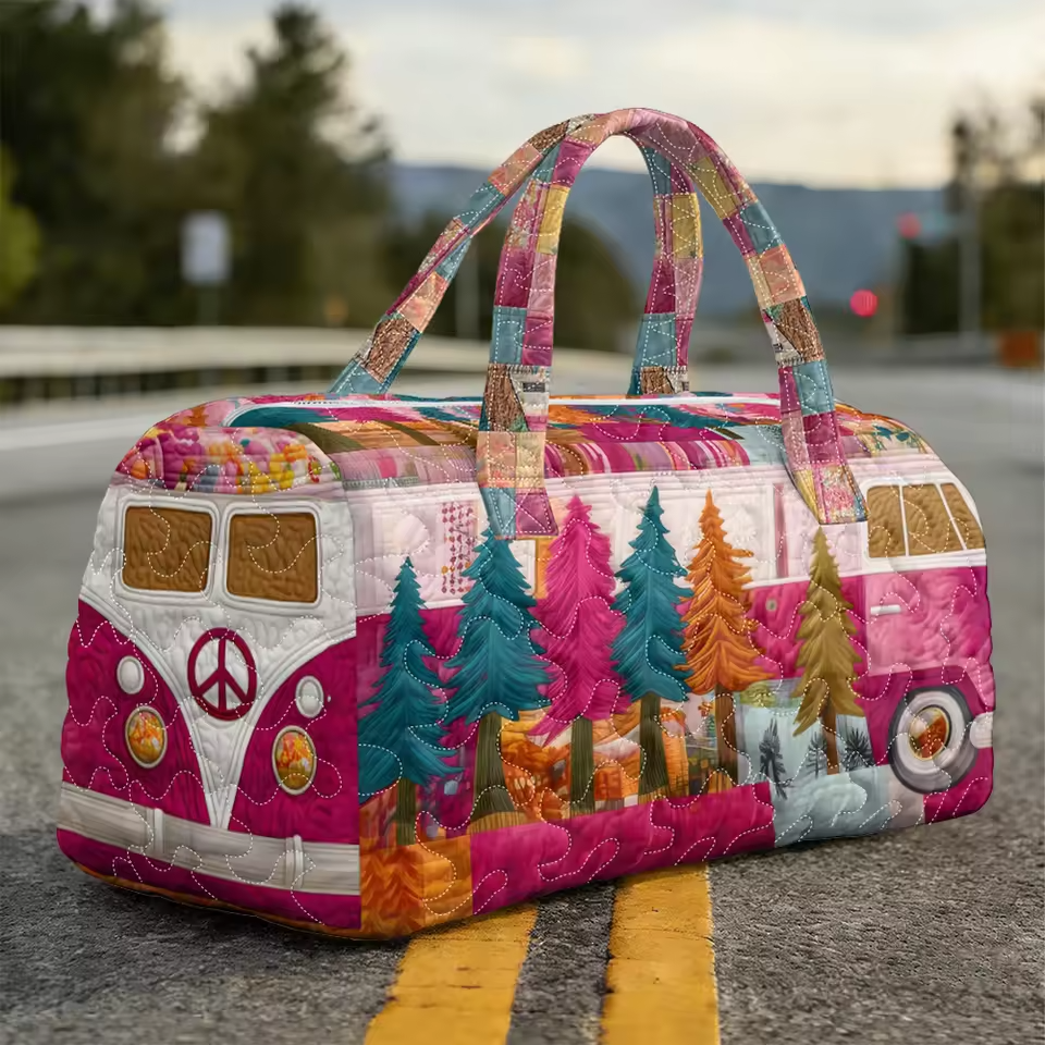 Quilted travel tote with multicolor patchwork houses, trees, and peace symbol on front