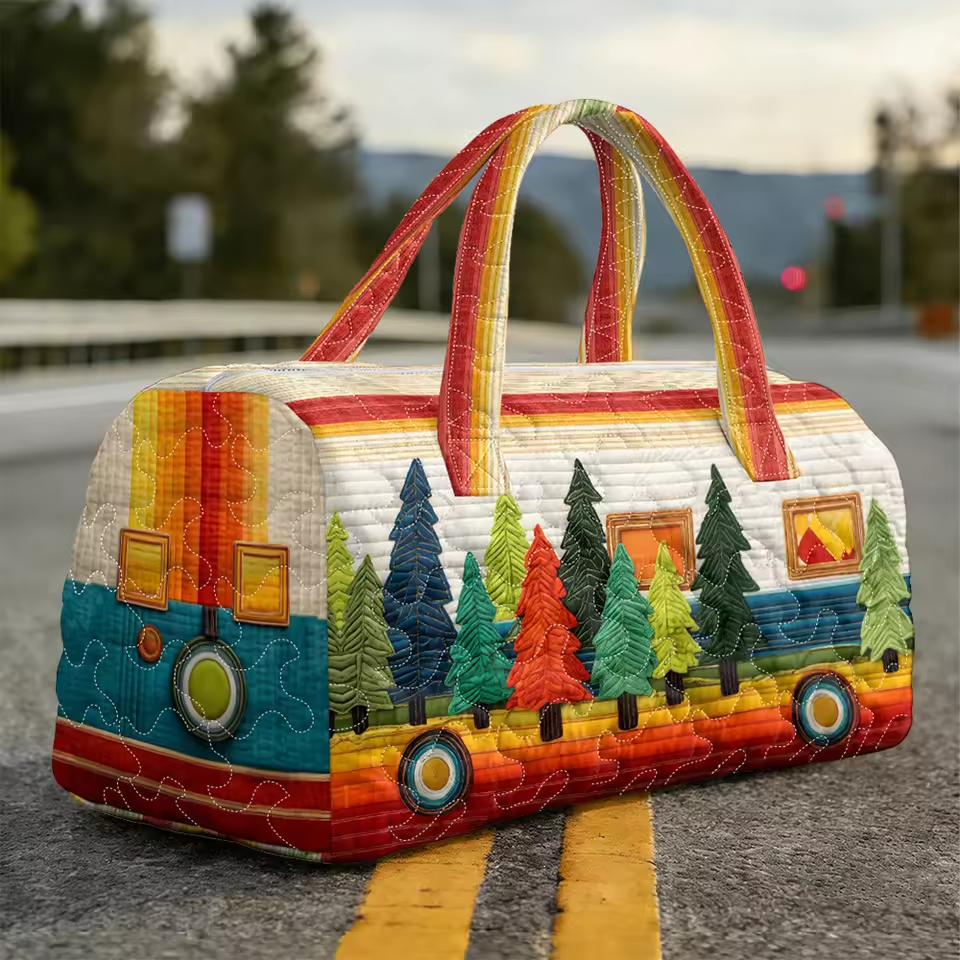 Quilted travel duffel with colorful forest and camper motif, double handles