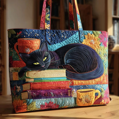 Quilted patchwork tote bag with black cat and stack of colorful books applique