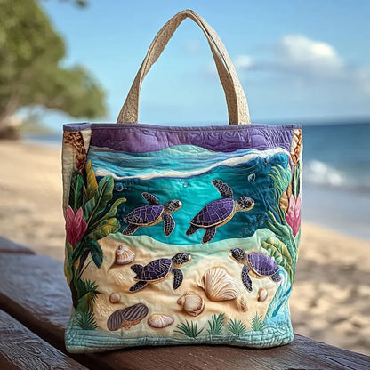 Handcrafted tote bag with embroidered sea turtles and shells; fabric top handles.