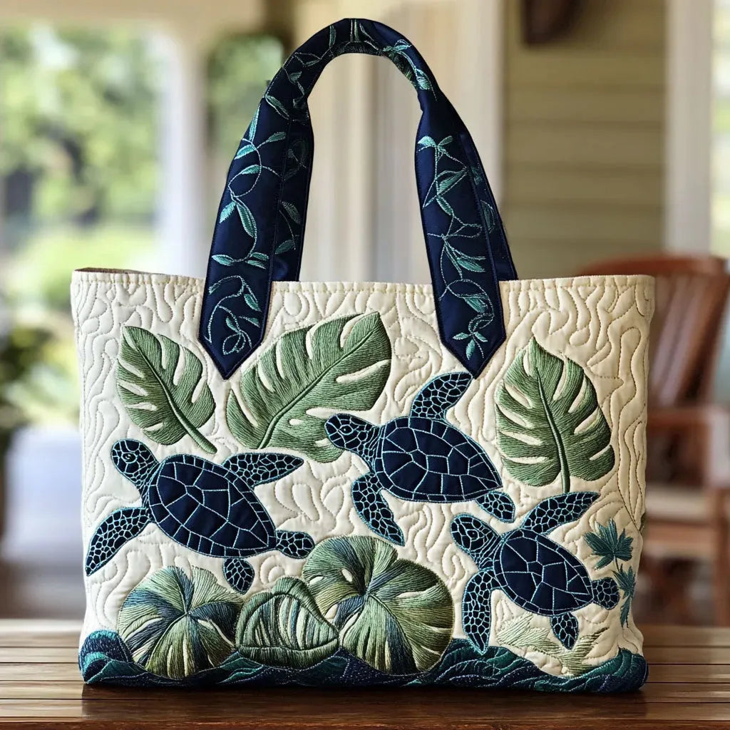 Handcrafted tote bag with sea turtle and tropical leaves, dark blue handles