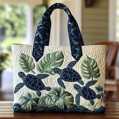 Handcrafted tote bag with sea turtle and tropical leaves, dark blue handles