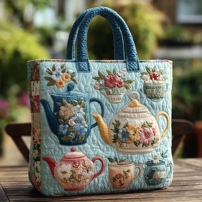 Quilted turquoise floral tote bag with applique teapots and double fabric handles