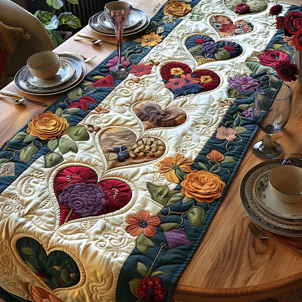 Quilted table runner with appliqued multicolor flowers on cream fabric, scalloped stitch detailing