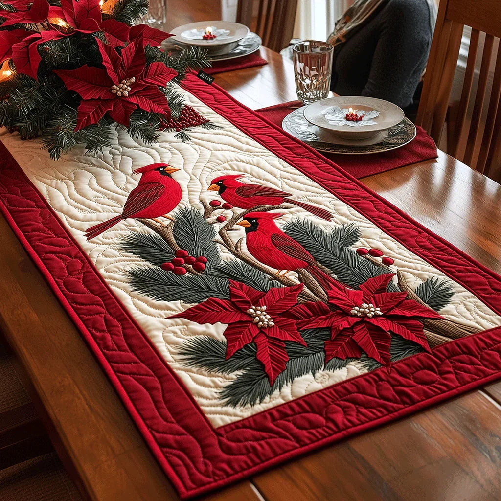 Quilted red table runner with bird and poinsettia floral appliques, stitched border.
