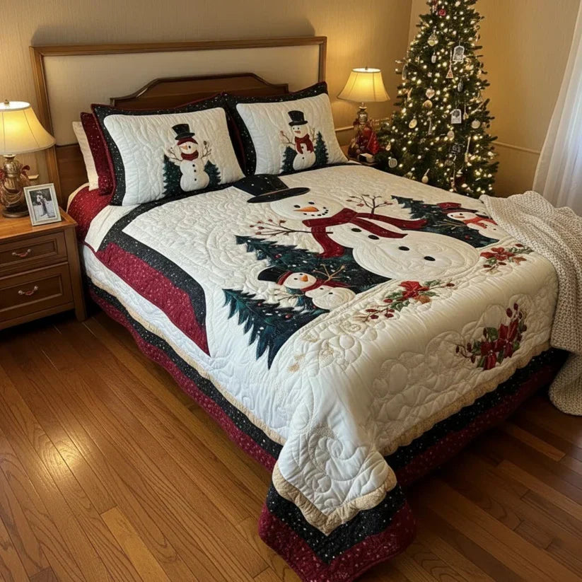 Quilted bed set with white comforter and two pillow shams, snowman-and-forest applique scene