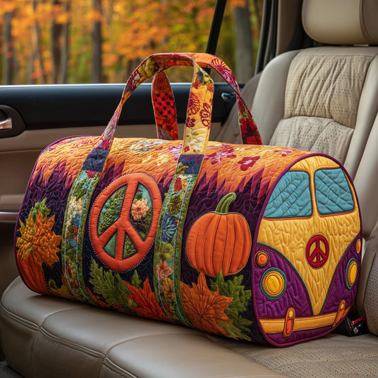 Quilted duffle bag with colorful pumpkin and peace-sign patches, top handle