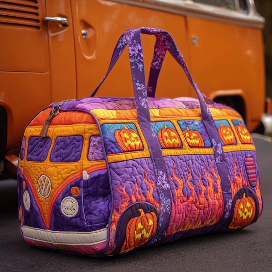 Quilted duffle bag in purple and yellow with jack-o-lantern pumpkin patchwork, top handles