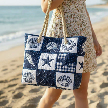 Shell Serenity handcrafted beach bag, navy-and-white patchwork shells with rope handles