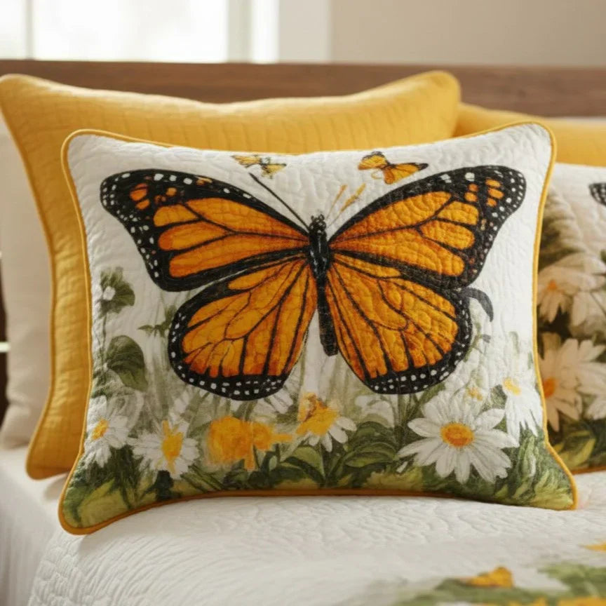 Quilted cushion cover with monarch butterfly and daisy floral border, yellow piping.