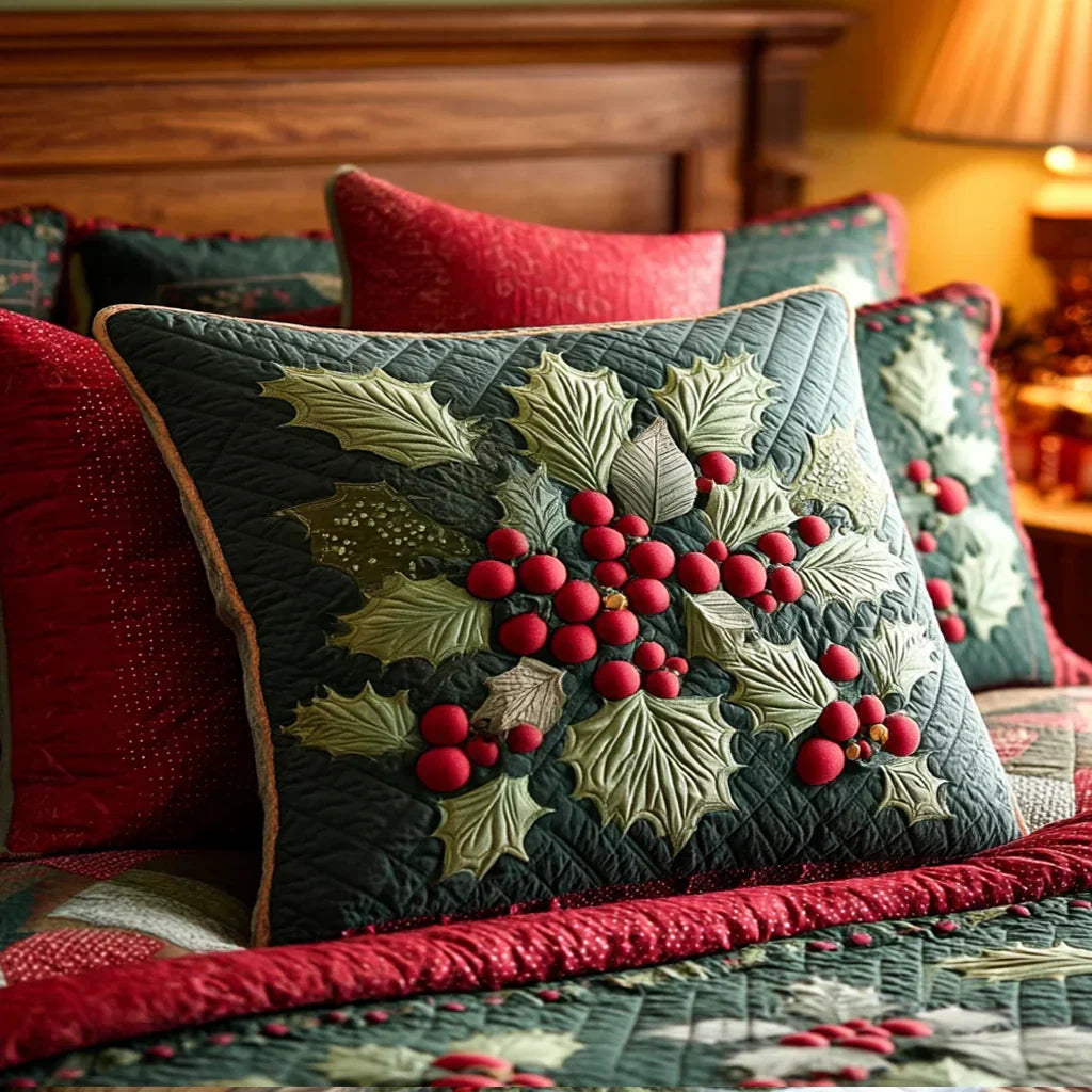 Quilted dark green cushion cover with embroidered holly leaves and red berry cluster, piped edge
