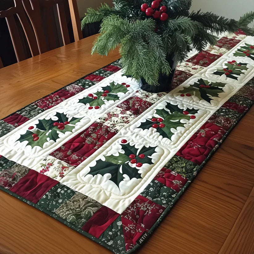 Quilted Christmas table runner with holly, berries, and red-green patchwork