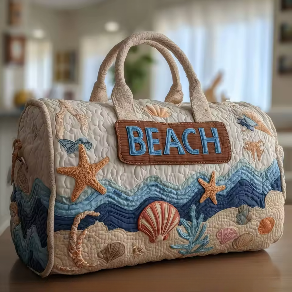 Quilted soft travel bag with top handles and seaside appliques; BEACH patch.