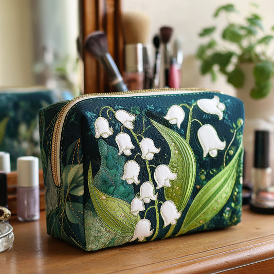 Padded makeup bag with blue-green floral print and gold zipper closure