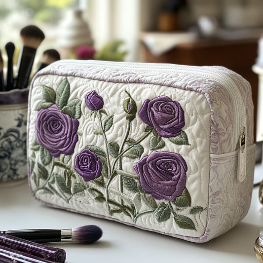 Padded makeup bag with quilted fabric, purple rose embroidery, and side zipper
