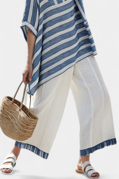 Cream wide-leg pants with blue cuff trim and striped tunic hem
