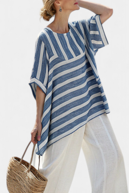 Blue striped tunic with elbow-length sleeves over cream wide-leg pants