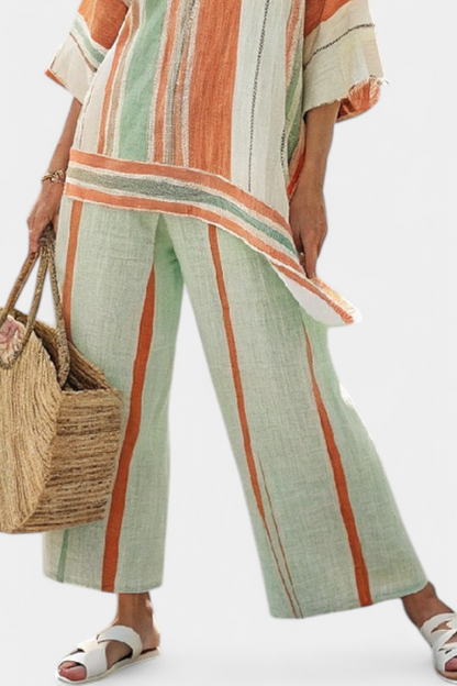 Striped wide-leg pants and tunic set with ruffled hem, green base with orange cream stripes.