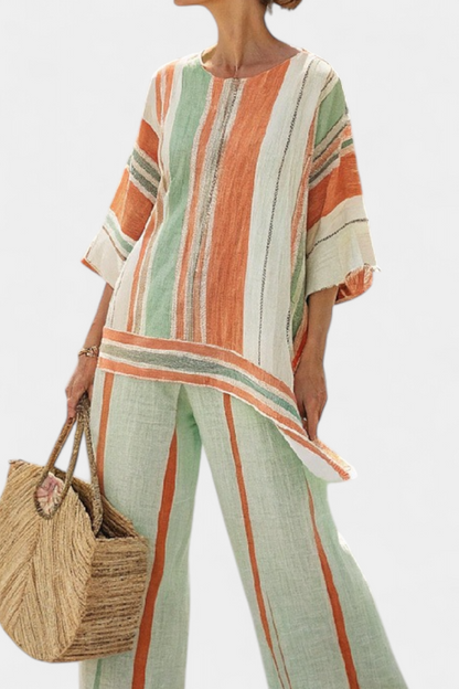 Striped tunic and wide-leg pants set with ruffled sleeve hems in green, orange, and cream.