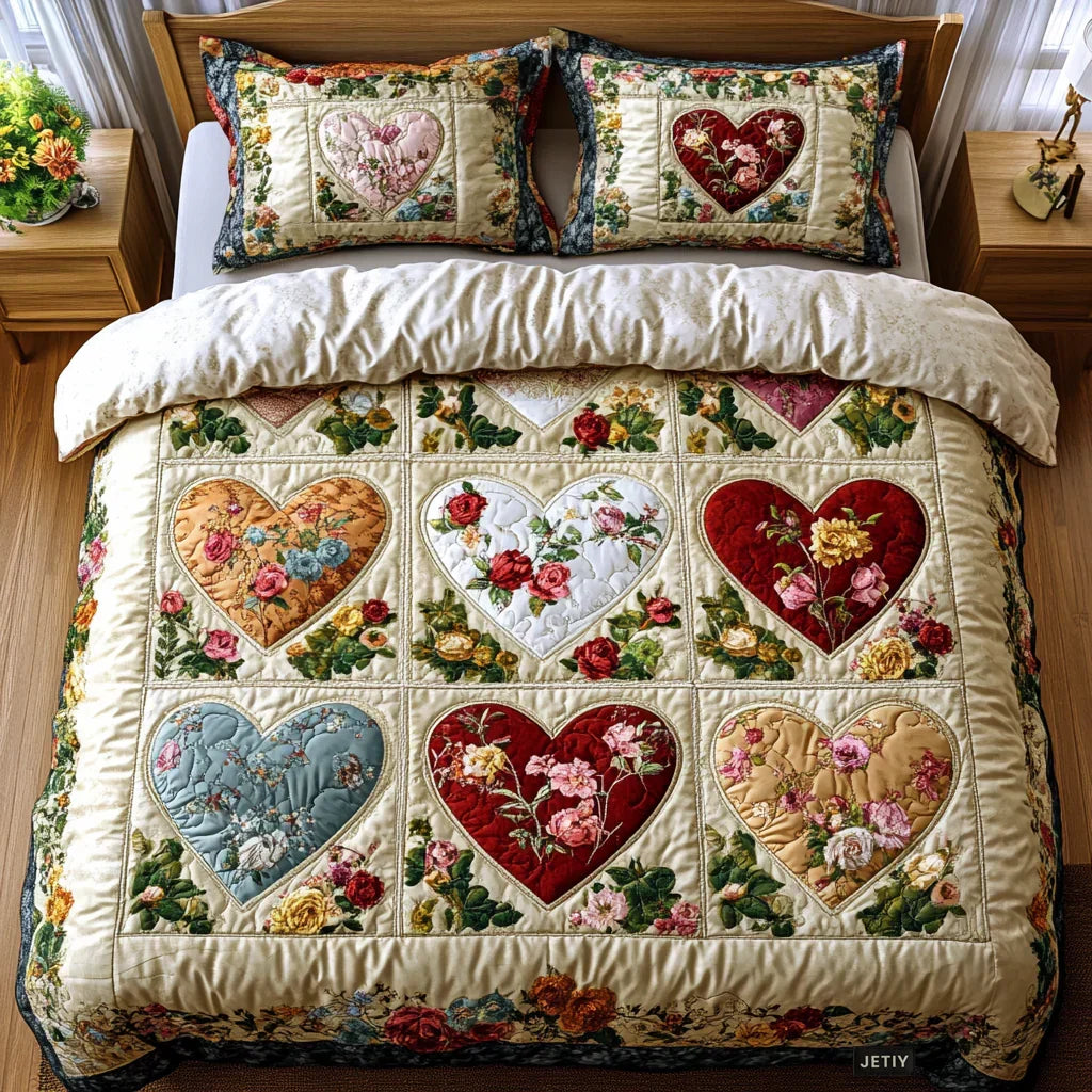 Quilted bed set with floral heart patchwork comforter and two matching pillow shams