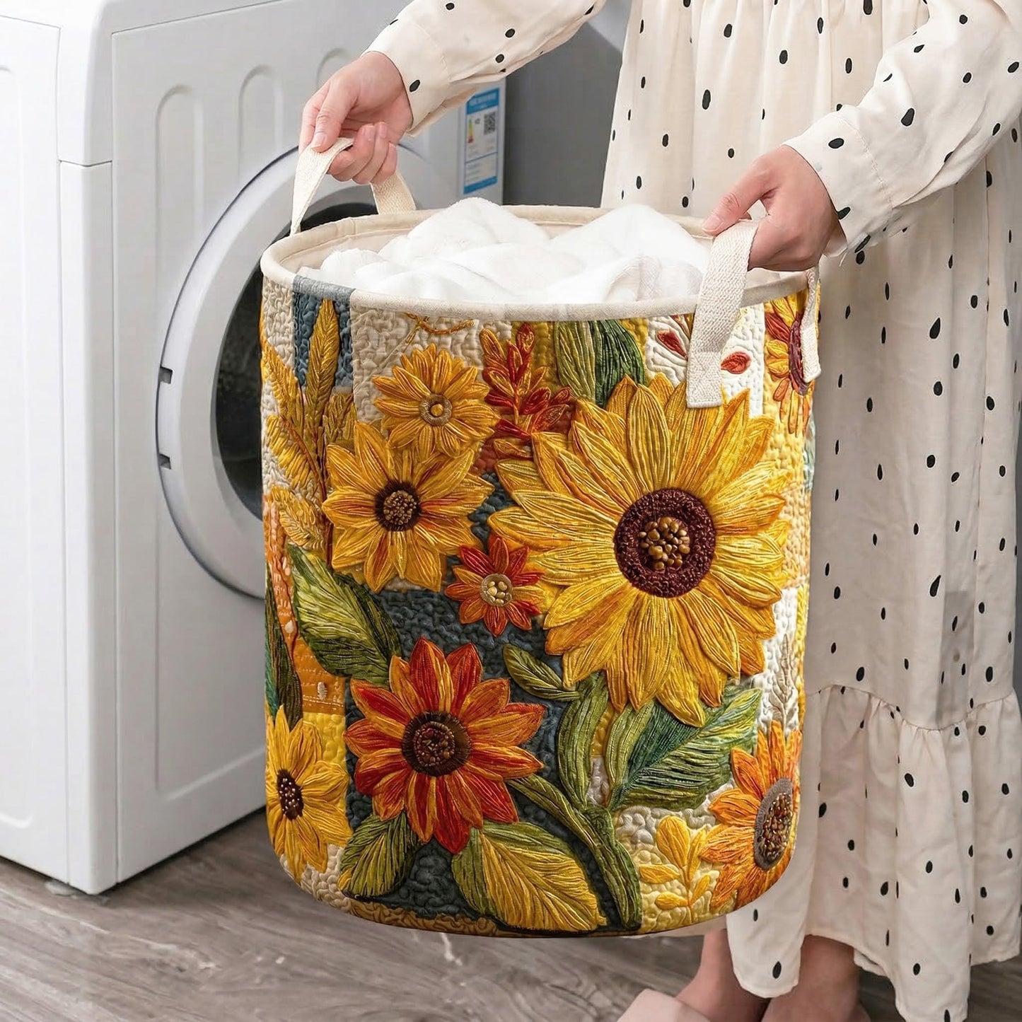 Quilted laundry hamper with large sunflower floral design and side fabric handles