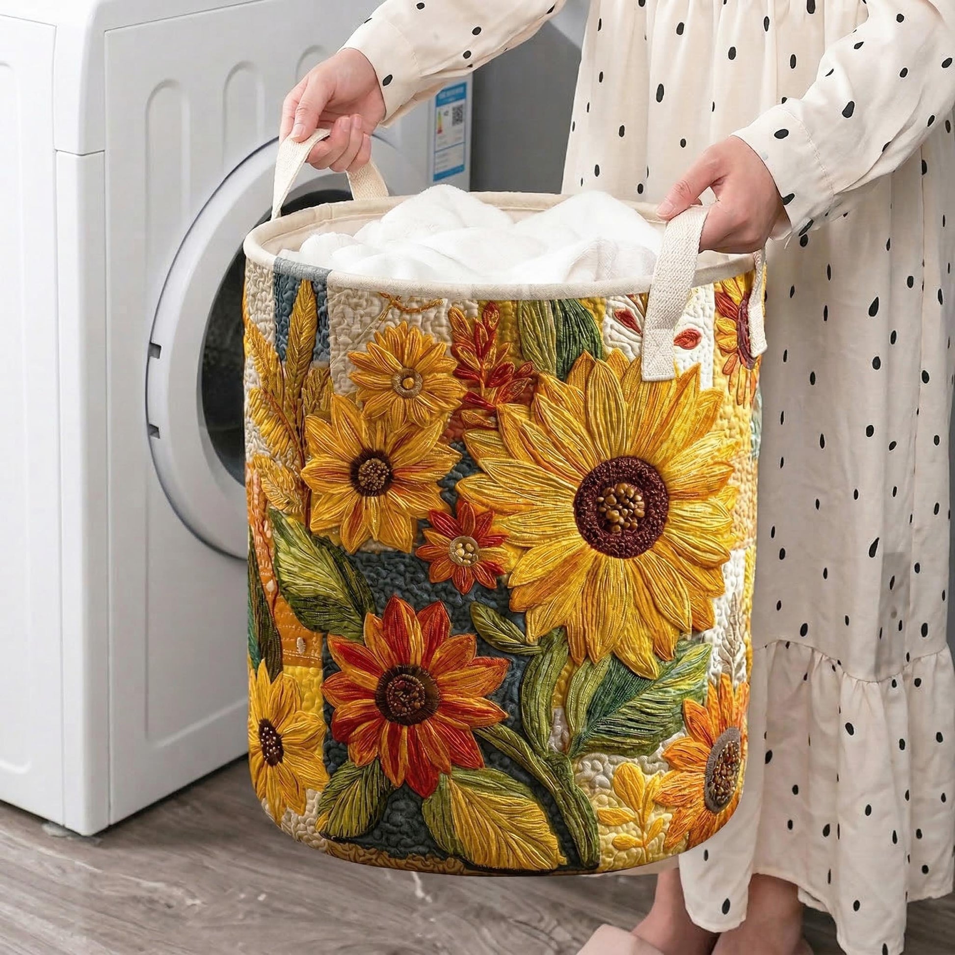 Quilted laundry hamper with large sunflower floral design and side fabric handles