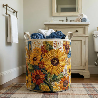 Quilted round laundry hamper with sunflower embroidery, open top holding folded clothes