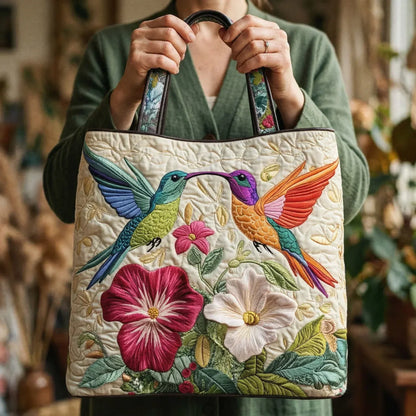 Embroidered hummingbird quilted tote bag with floral patchwork, black top handles