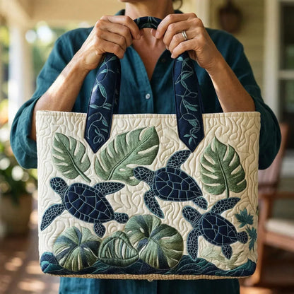 Handcrafted tote bag front view with sea turtles, palm leaves, and patterned handles