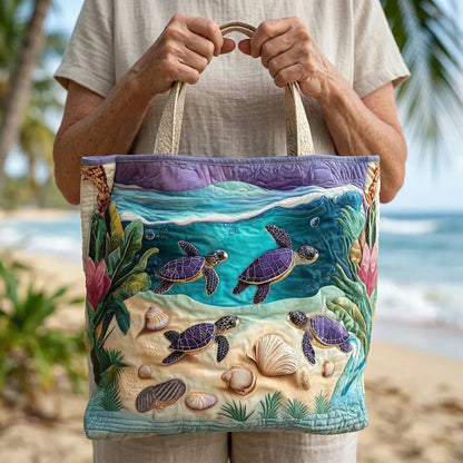 Handheld tote bag featuring embroidered sea turtles and shells with two fabric handles.